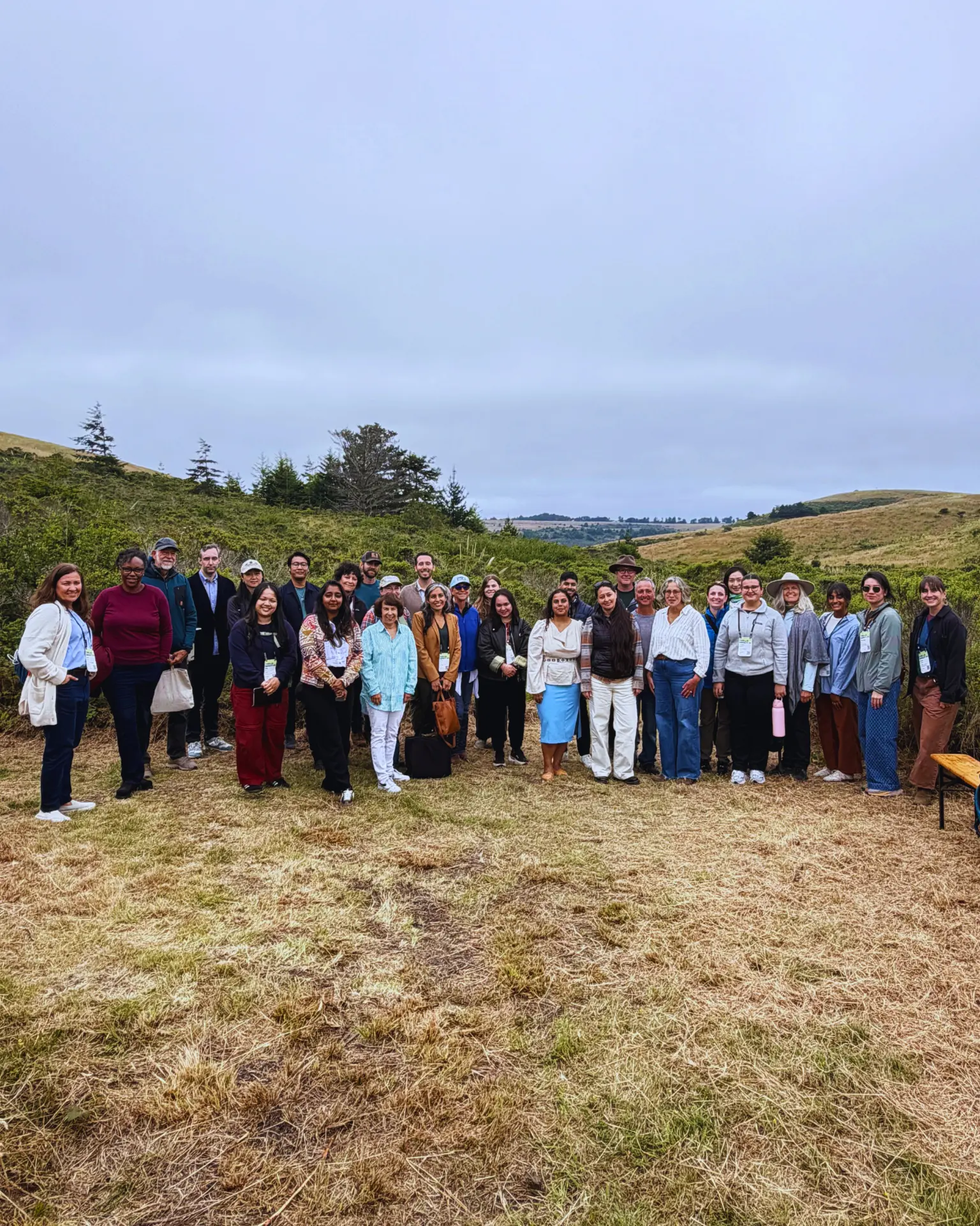 ProgramEarth partners and community members gathered on a coastal restoration site